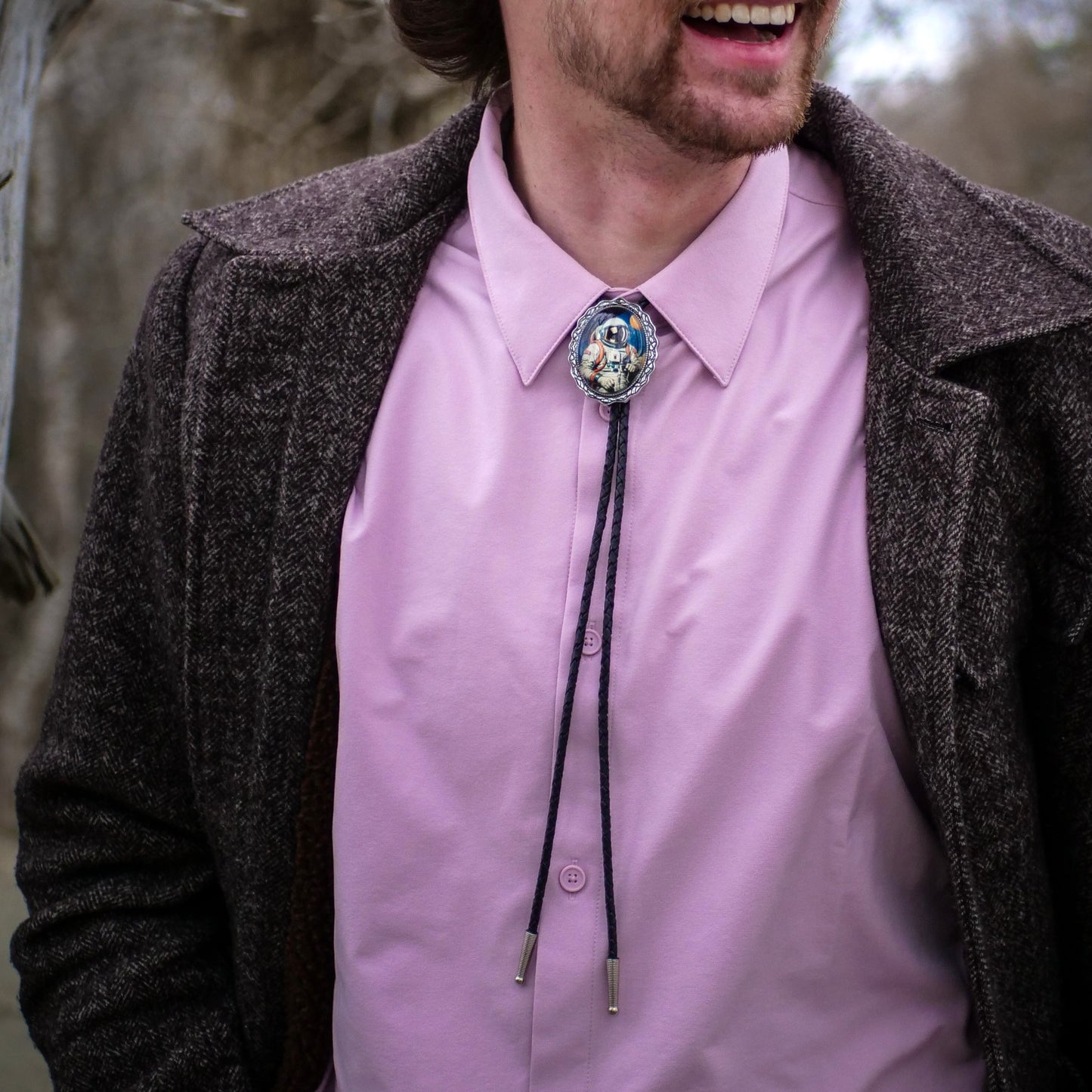 man at a wedding wearing a bolo tie outfit