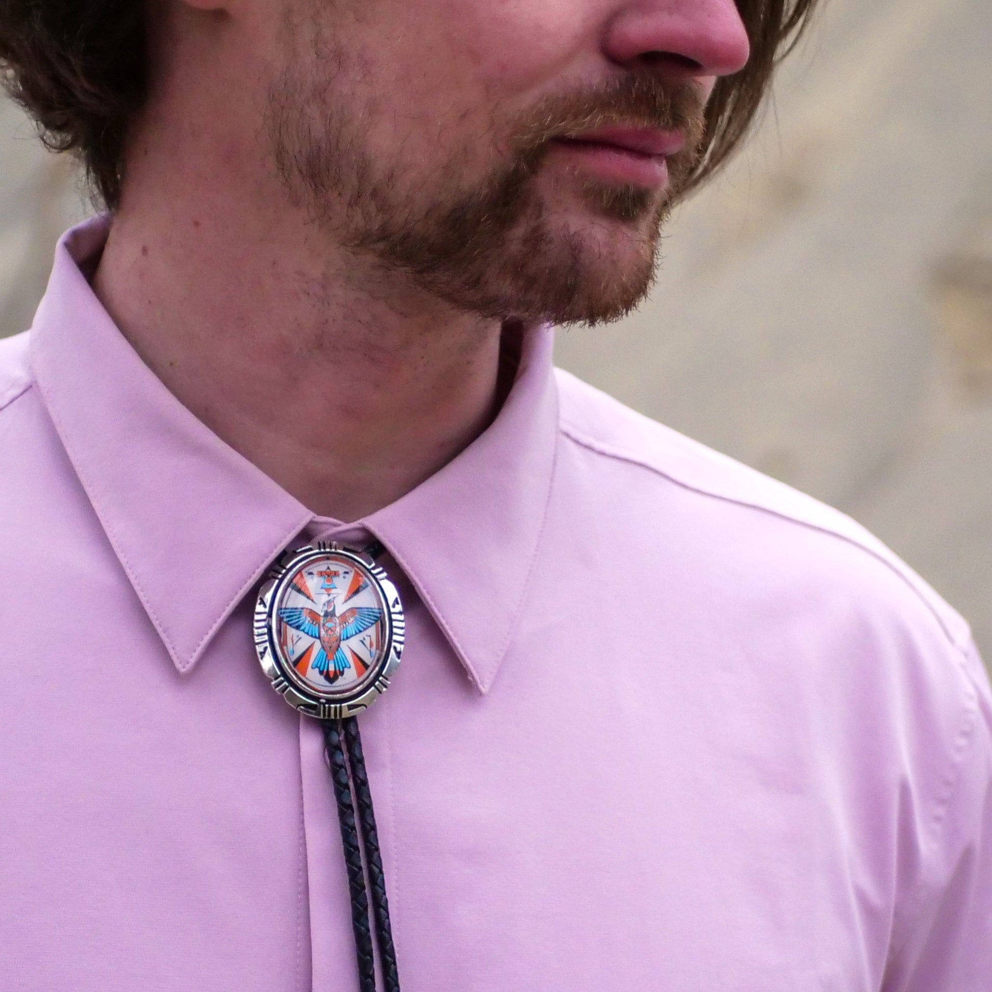 Do you button the top button with a bolo tie?