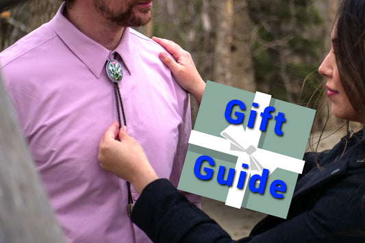 A woman adjusts a man's tie with her hand on his shoulder