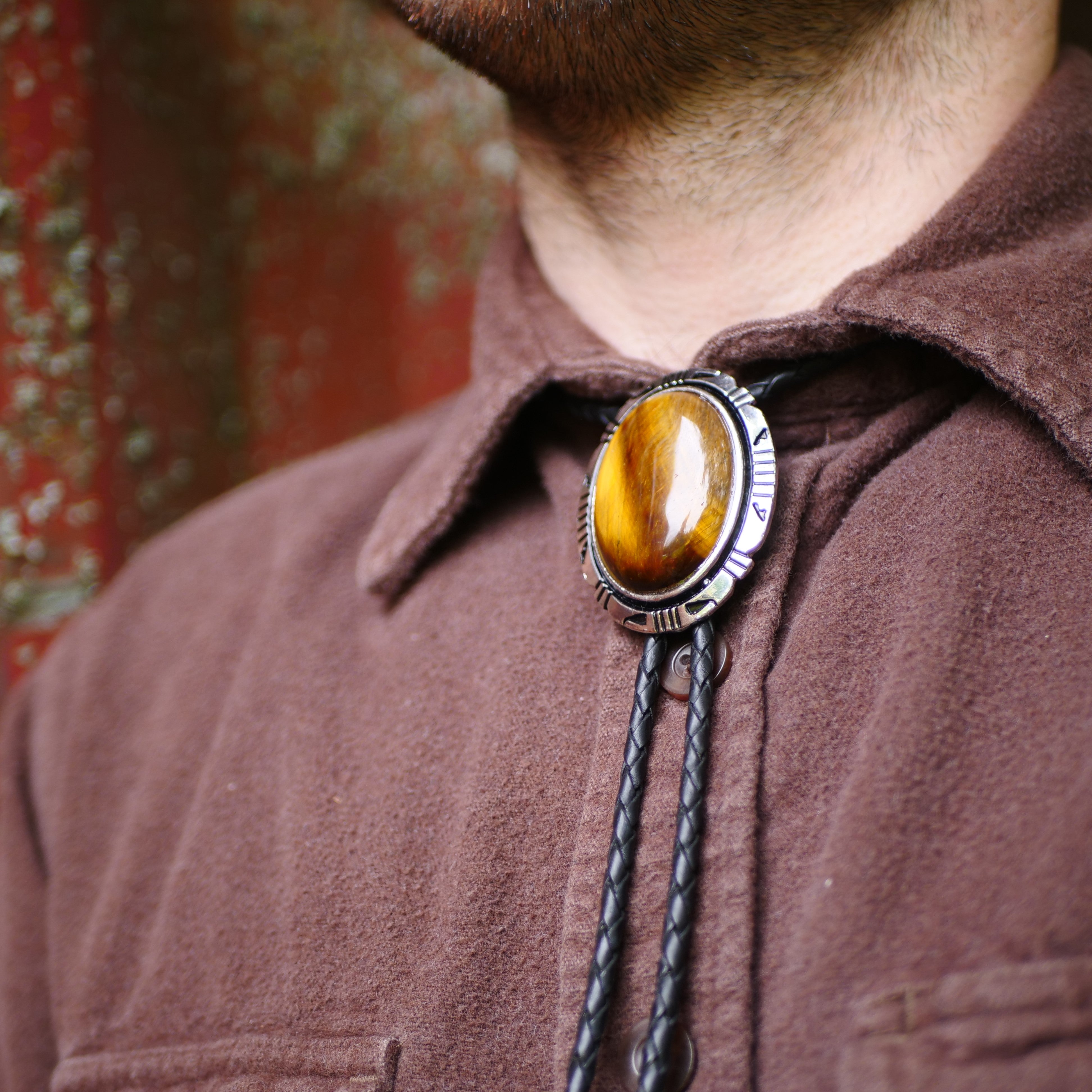 Gyserite Bolo Tie. on sale Cool stone with rootbeer edges and swirling obicular patterns. Leather cord